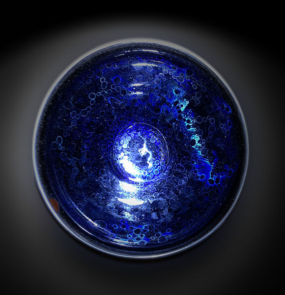 Jian ware. Yohen tenmoku tea bowl with blue and green "oil spot" marks.