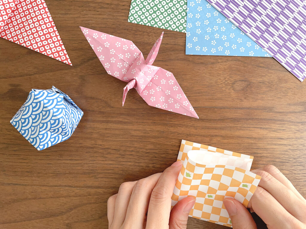 The hands of a Japanese woman folding origami